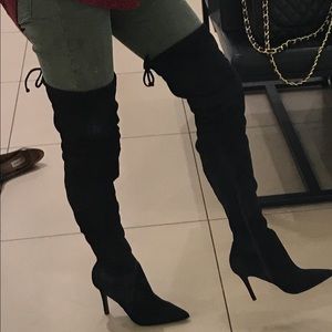 Black knee high boots.